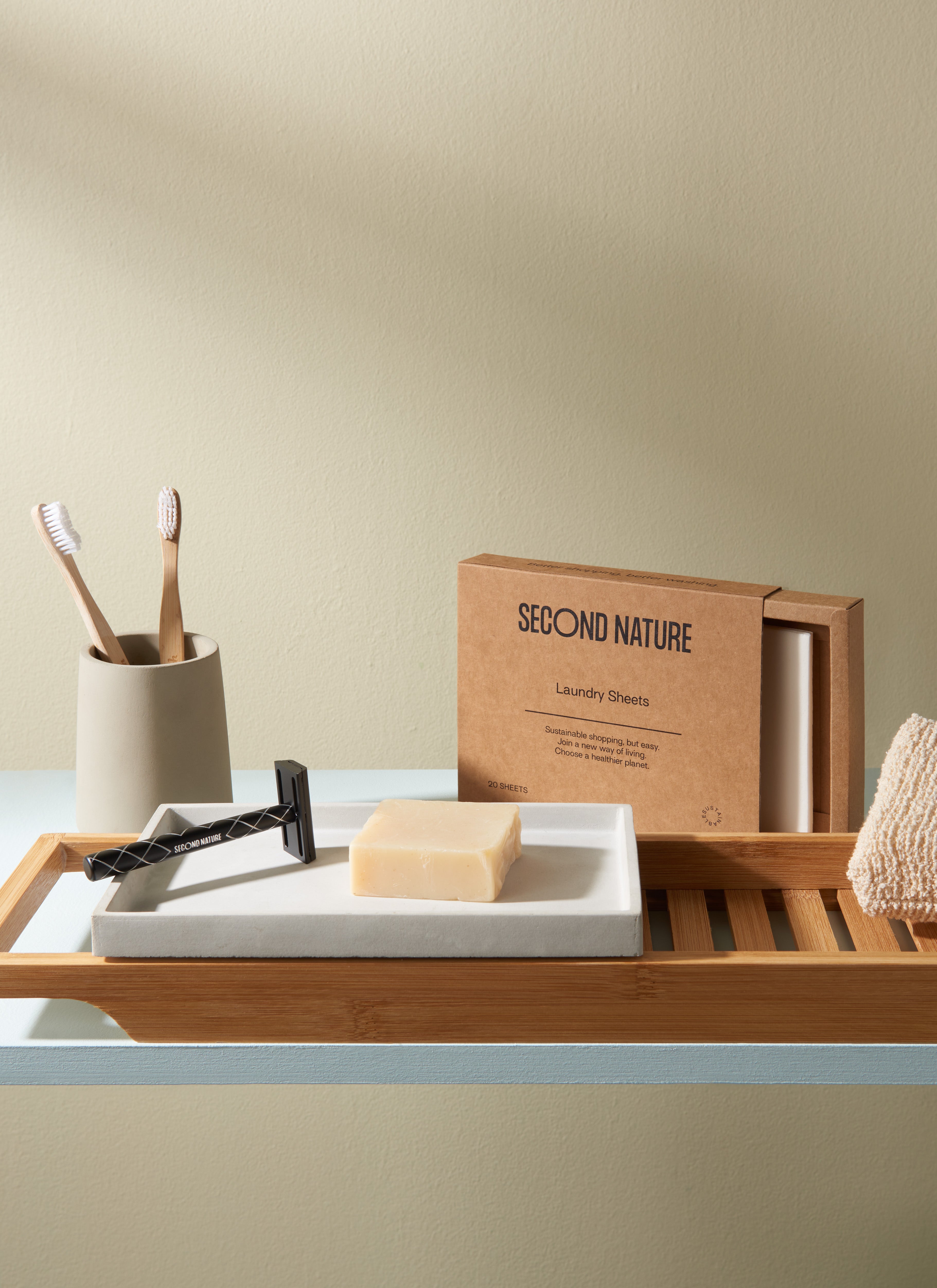 Second Nature zwart scheermesje en wasdoekjes wasmachine tussen badspullen